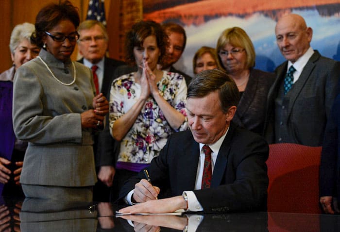Colorado Governor signs a series of gun control bills in 2013. 